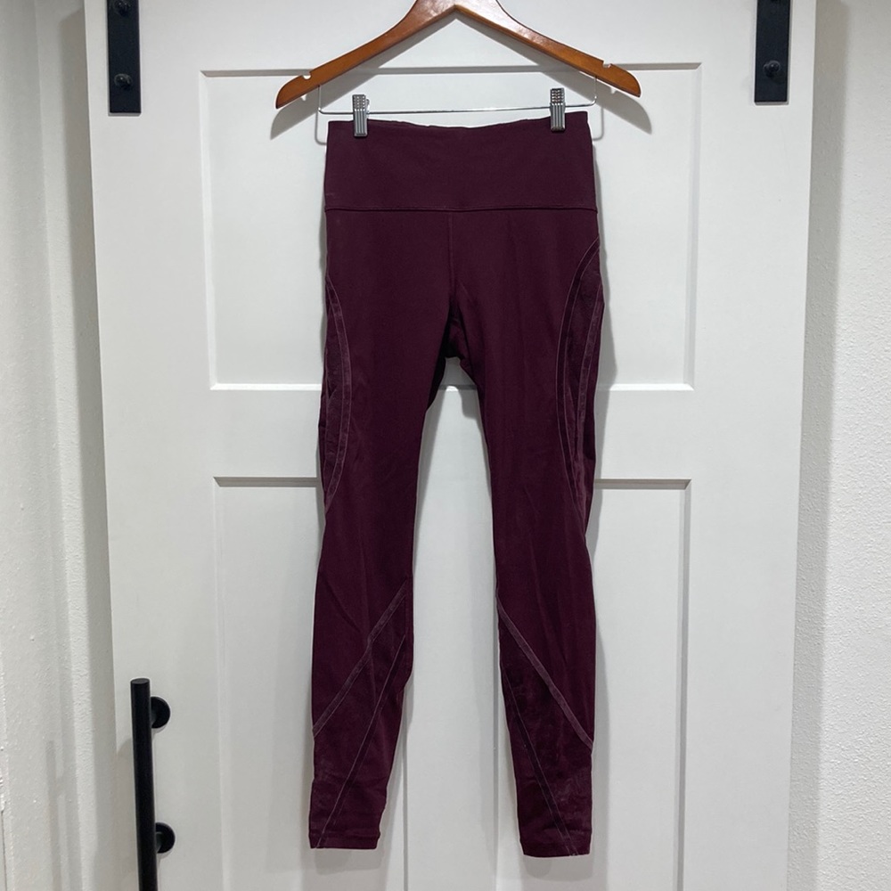 Burgundy long Lululemon leggings with lace mesh and velvet ribbon accents